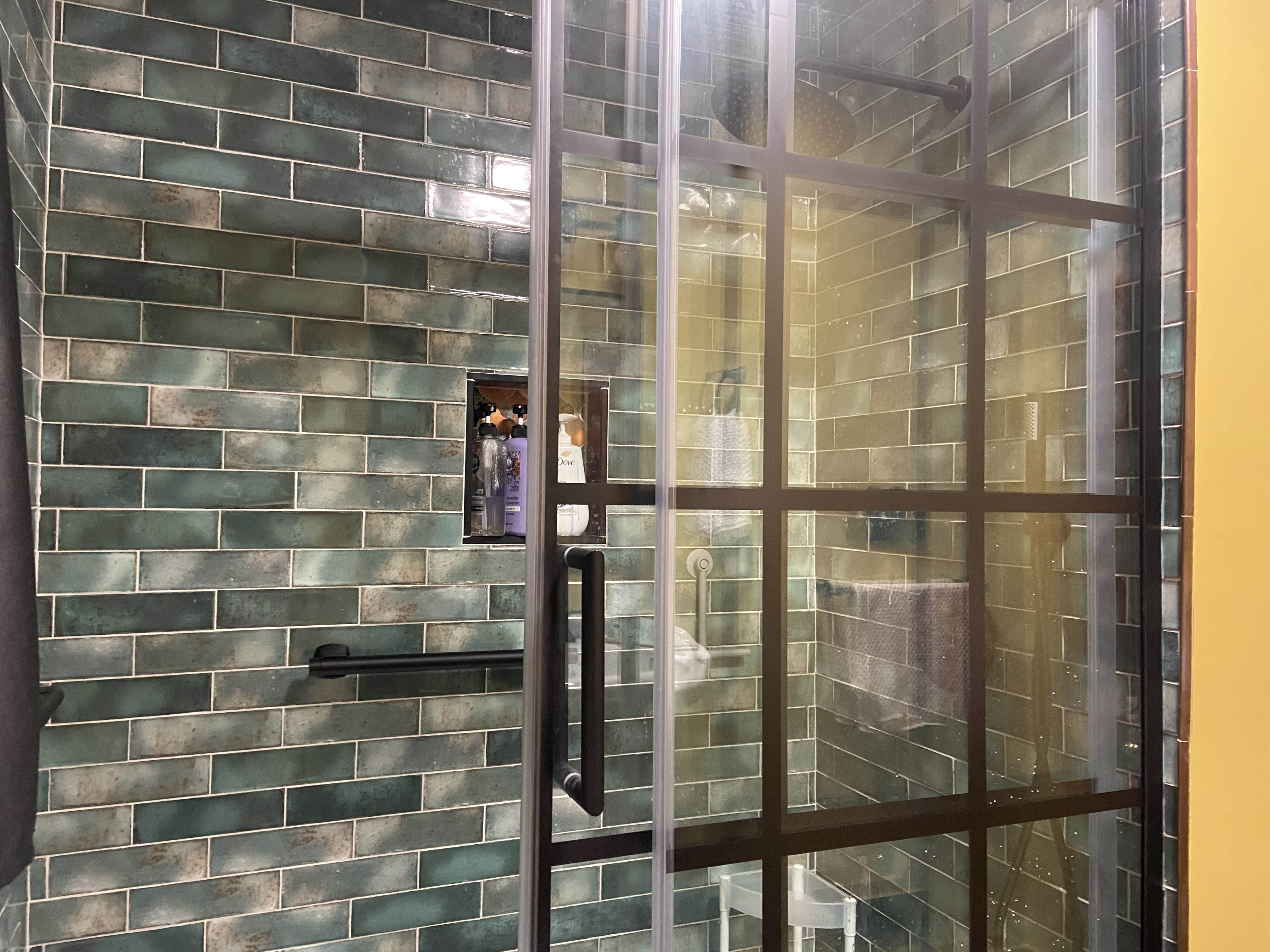 Highlighting excellent tile work for a shower that was completed during a bathroom renovation