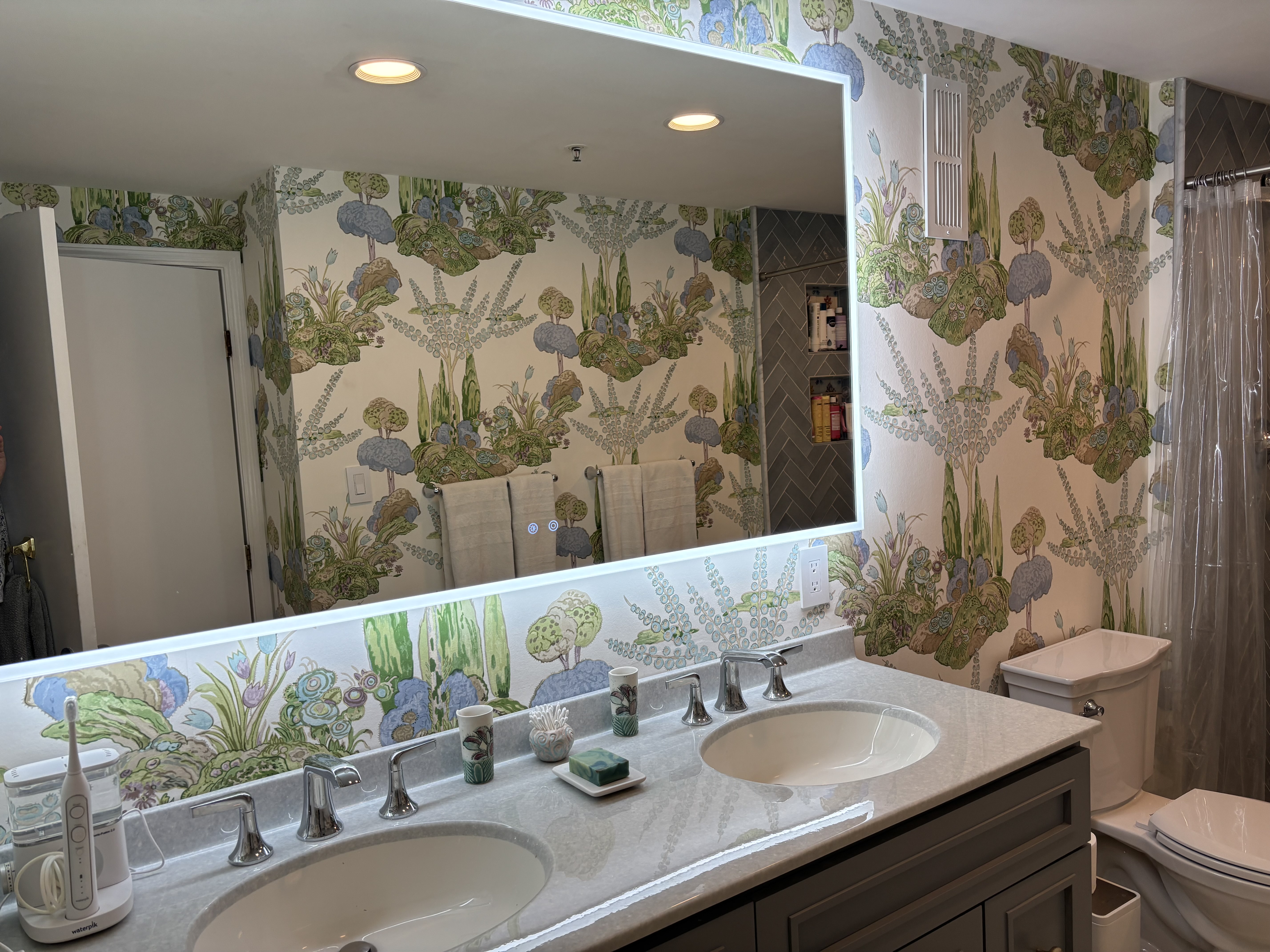 Vanity highlight of full bathroom remodel with electronic mirror